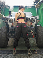 Streetwear Cuffed Cargo Pants in dark grey fabric with neon pink pocket accent, featuring a unisex cuffed pant style and bold prints. Perfect for urban fashion and fashion-forward wardrobes, these lightweight and versatile pants redefine streetwear aesthetics.