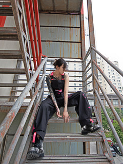Dark Grey Overalls by TAPE OFF, featuring utility-inspired design, cuffed pant legs, neon pink stitching, and modern workwear-inspired style. Unisex streetwear overalls for industrial fashion and urban looks.