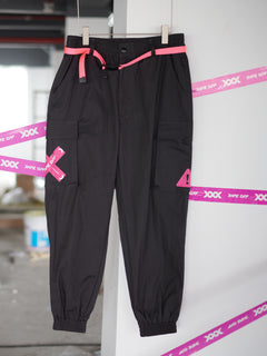 Streetwear Cuffed Cargo Pants in dark grey fabric with neon pink pocket accent, featuring a unisex cuffed pant style and bold prints. Perfect for urban fashion and fashion-forward wardrobes, these lightweight and versatile pants redefine streetwear aesthetics.