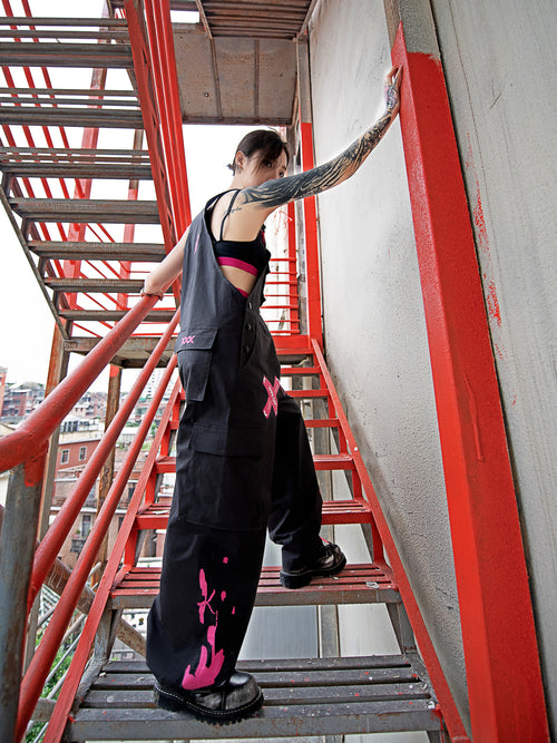Dark Grey Overalls by TAPE OFF, featuring utility-inspired design, cuffed pant legs, neon pink stitching, and modern workwear-inspired style. Unisex streetwear overalls for industrial fashion and urban looks.