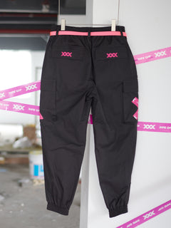 Streetwear Cuffed Cargo Pants in dark grey fabric with neon pink pocket accent, featuring a unisex cuffed pant style and bold prints. Perfect for urban fashion and fashion-forward wardrobes, these lightweight and versatile pants redefine streetwear aesthetics.