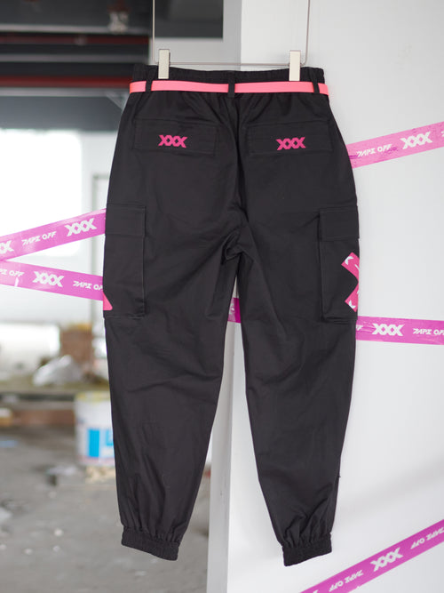 Streetwear Cuffed Cargo Pants in dark grey fabric with neon pink pocket accent, featuring a unisex cuffed pant style and bold prints. Perfect for urban fashion and fashion-forward wardrobes, these lightweight and versatile pants redefine streetwear aesthetics.