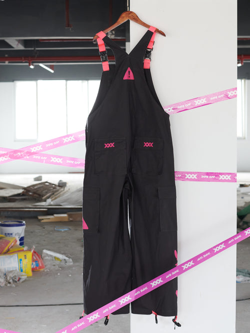 Dark Grey Overalls by TAPE OFF, featuring utility-inspired design, cuffed pant legs, neon pink stitching, and modern workwear-inspired style. Unisex streetwear overalls for industrial fashion and urban looks.