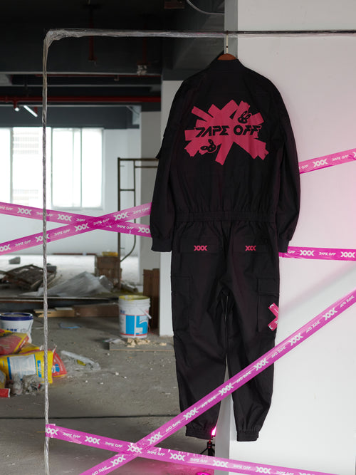 Dark Grey Jumpsuit featuring bomber jacket style, cuffed pants, chunky zipper, and neon accent lining. Perfect for streetwear, industrial fashion, and urban style trends.