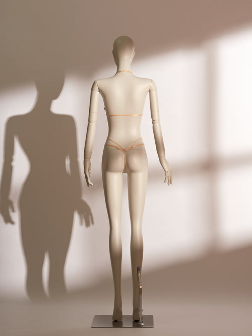 Elegant Celestial Divinity Gilding Bralette set in a shimmering gold tone, featuring delicate eyelash lace and a halter neck design. The bralette is paired with a matching strappy lace thong, both adorned with a luxurious gilding effect. A front closure and minimalist silhouette bring together sophistication, seduction, and comfort in this standout lingerie ensemble from the Pills N Poison collection.