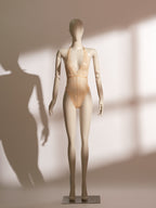 model wearing golden sheer lace bodysuit