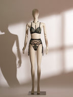 Front view of the luxurious Emerald Obsidian Embroidery Bralette paired elegantly with the matching Embroidery Garter Belt. The bralette showcases vibrant emerald embroidery and delicate shimmer mesh, enhanced by a glamorous detachable rhinestone choker. The intricately designed garter belt features symmetrical embroidered detailing and crossed straps, creating a sophisticated and seductive lingerie ensemble from Pills N Poison.