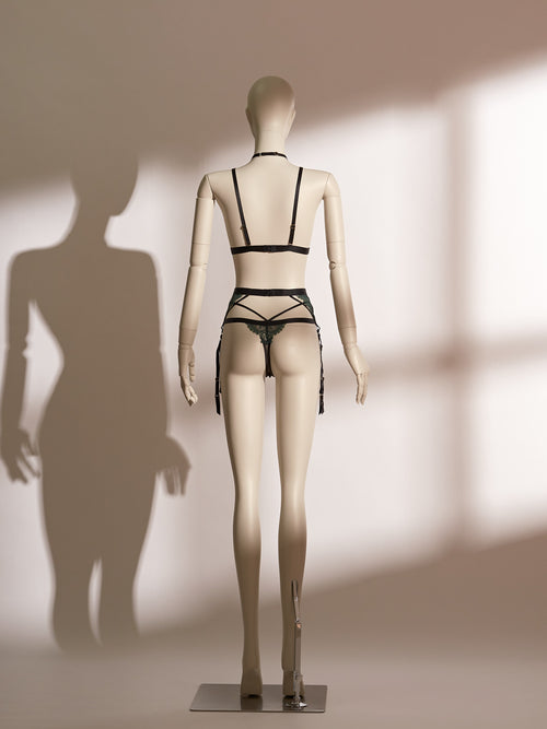 Back view of the luxurious Emerald Obsidian Embroidery Bralette paired elegantly with the matching Embroidery Garter Belt. The bralette showcases vibrant emerald embroidery and delicate shimmer mesh, enhanced by a glamorous detachable rhinestone choker. The intricately designed garter belt features symmetrical embroidered detailing and crossed straps, creating a sophisticated and seductive lingerie ensemble from Pills N Poison.