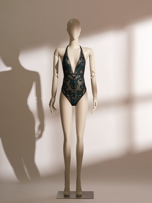 model wearing black sheer lace bodysuit