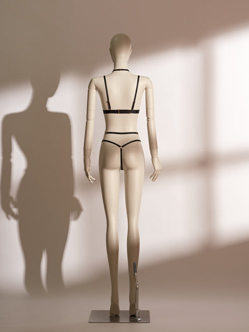 Black lace Flame Bralette Set Bodychain 3-piece lingerie set displayed on a mannequin, featuring a halter-style wireless bralette, a matching low-rise thong, and a detachable gold body chain accessory.