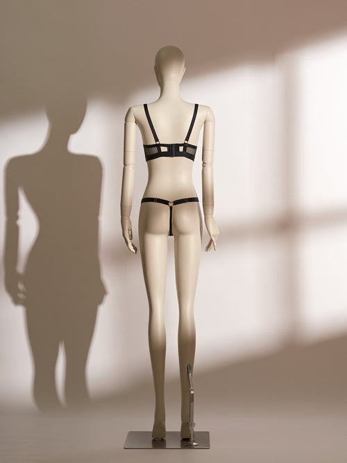 Heartbound Wire Bra Set in black eyelash lace and jacquard mesh, featuring a structured underwire bra with strappy detailing and a central heart-shaped hardware accent. Paired with a matching thong showcasing a wide waistband and heart embellishment, this seductive lingerie set from the Pills N Poison collection blends romantic flair with bold support.