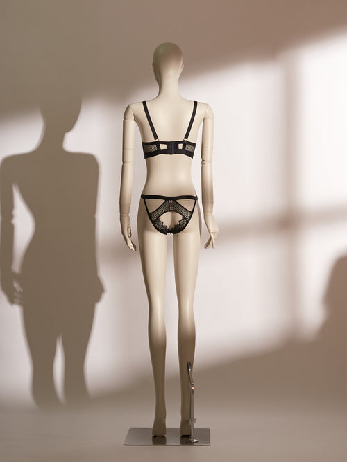Heartbound Wire Bra Set in black eyelash lace and jacquard mesh, featuring a structured underwire bra with strappy detailing and a central heart-shaped hardware accent. Paired with a matching thong showcasing a wide waistband and heart embellishment, this seductive lingerie set from the Pills N Poison collection blends romantic flair with bold support.