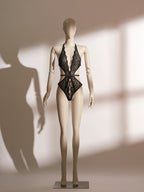 Infernal Grace Ouvert Bodysuit featuring deep lace neckline, S-curve waist, and bold strappy ouvert design for seductive allure