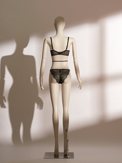 Infernal Grace Underwire Bra Set in black lace, featuring a full-cup design with intricate floral lace, supportive underwire, and adjustable strappy accents that wrap elegantly around the waist. Paired with a matching lace thong, this seductive lingerie set from the Pills N Poison collection combines timeless sophistication with versatile styling.