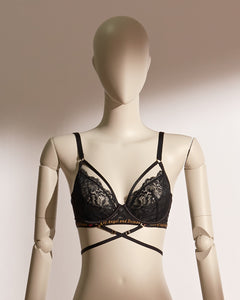 Infernal Grace Underwire Bra Set in black lace, featuring a full-cup design with intricate floral lace, supportive underwire, and adjustable strappy accents that wrap elegantly around the waist. Paired with a matching lace thong, this seductive lingerie set from the Pills N Poison collection combines timeless sophistication with versatile styling.