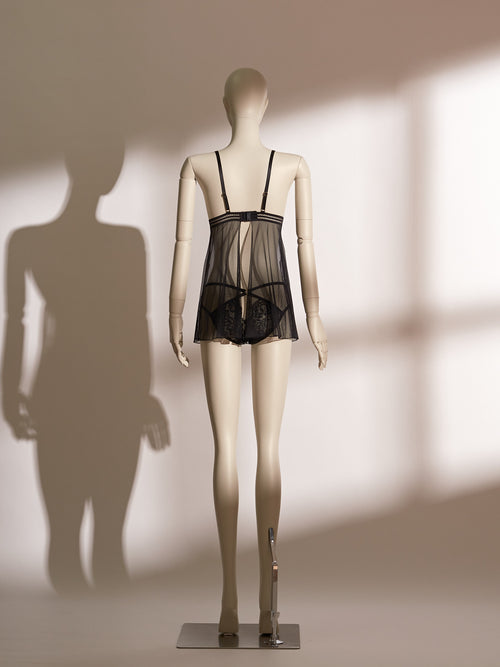 Midnight Allure Shimmer Babydoll featuring sheer black mesh, floral lace triangle cups, a plunging V-neckline, and matching strappy lace thong for an elegant, romantic silhouette.