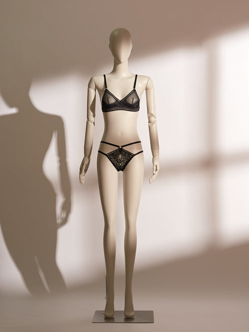 Midnight Allure Bralette Set in sheer black mesh and floral lace, featuring a wireless triangle bralette with wide straps and a secure hook-and-eye closure, paired with a matching low-rise thong detailed with cross-over elastic straps and delicate lace front panel. A chic and seductive lingerie design from Pills N Poison.