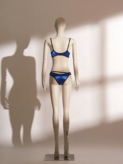 Electric blue satin underwire bra and thong set with bold black trim and strappy details, designed for petite figures and modern everyday wear.