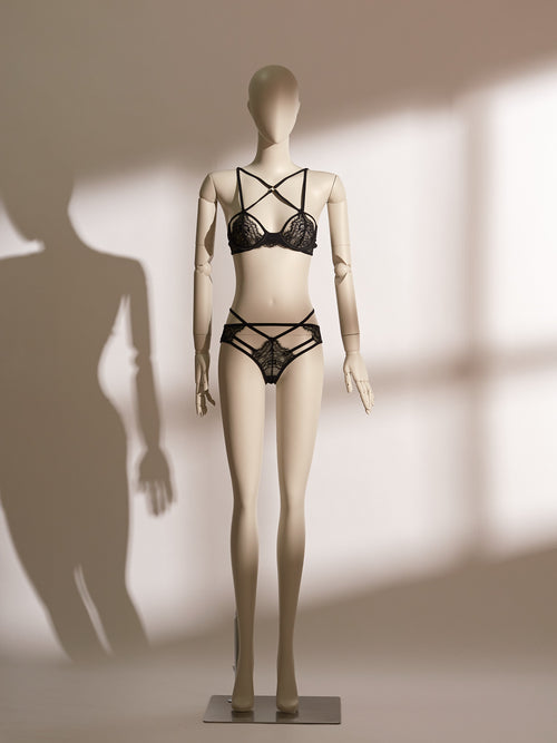 Black underwire lace bra with cross elastic straps and matching open-back strappy thong, featuring delicate eyelash lace and seductive cutouts, designed for a comfortable and seductive fit.