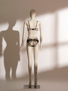 Black underwire lace bra with cross elastic straps and matching open-back strappy thong, featuring delicate eyelash lace and seductive cutouts, designed for a comfortable and seductive fit.