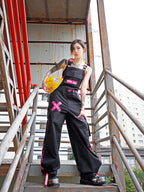 Dark Grey Overalls by TAPE OFF, featuring utility-inspired design, cuffed pant legs, neon pink stitching, and modern workwear-inspired style. Unisex streetwear overalls for industrial fashion and urban looks.