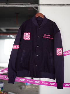 Unisex Enzyme Wash Baseball Jacket by [Your Brand Name], featuring a denim and cotton blend, enzyme wash for a soft, worn-in feel, dark purple color, and neon pink lining. Perfect for casual and sporty outfits, this lightweight streetwear jacket embodies Australian street style and gender-neutral fashion.