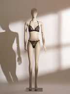 Celestial Chains Black Bralette Set featuring a sheer triangle lace bralette with gold accent hardware and matching lace thong, designed with gilded eyelash lace and a minimalist silhouette for a chic, seductive lingerie look.
