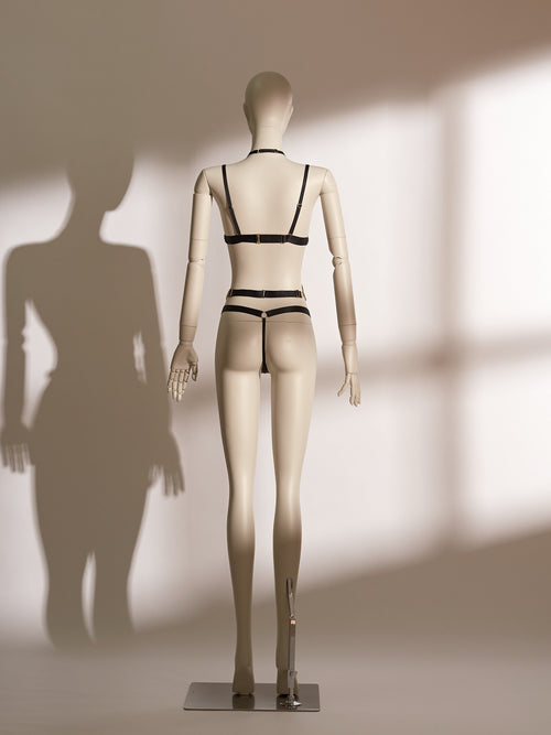 Valentina Noir Teddy featuring black mesh and gold lace cups, open crotch design, and adjustable waist strap—an avant-garde, seductive bodysuit by Pills N Poison.